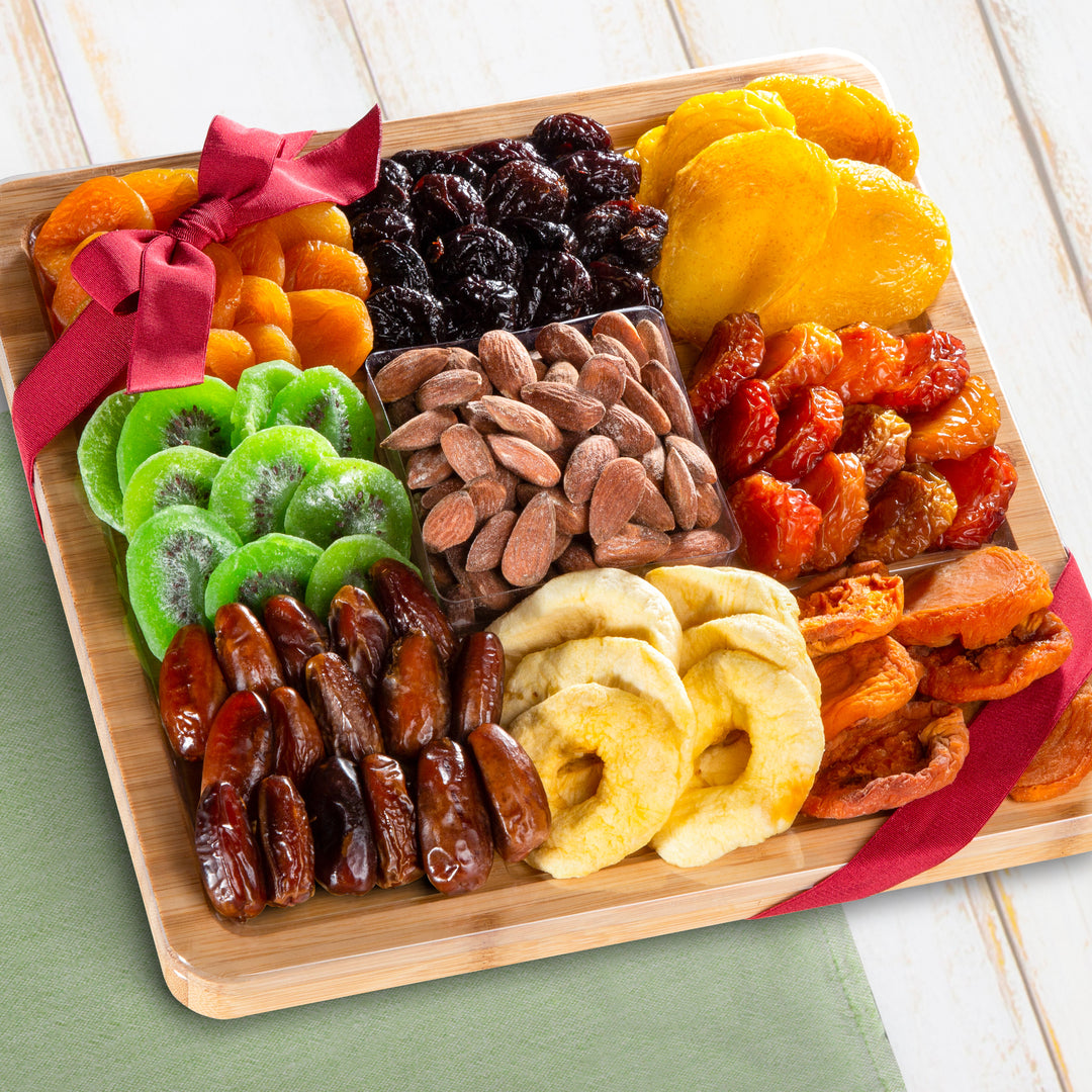 Dried Fruit Assortment with Almonds on Bamboo Cutting Board Serving Tray